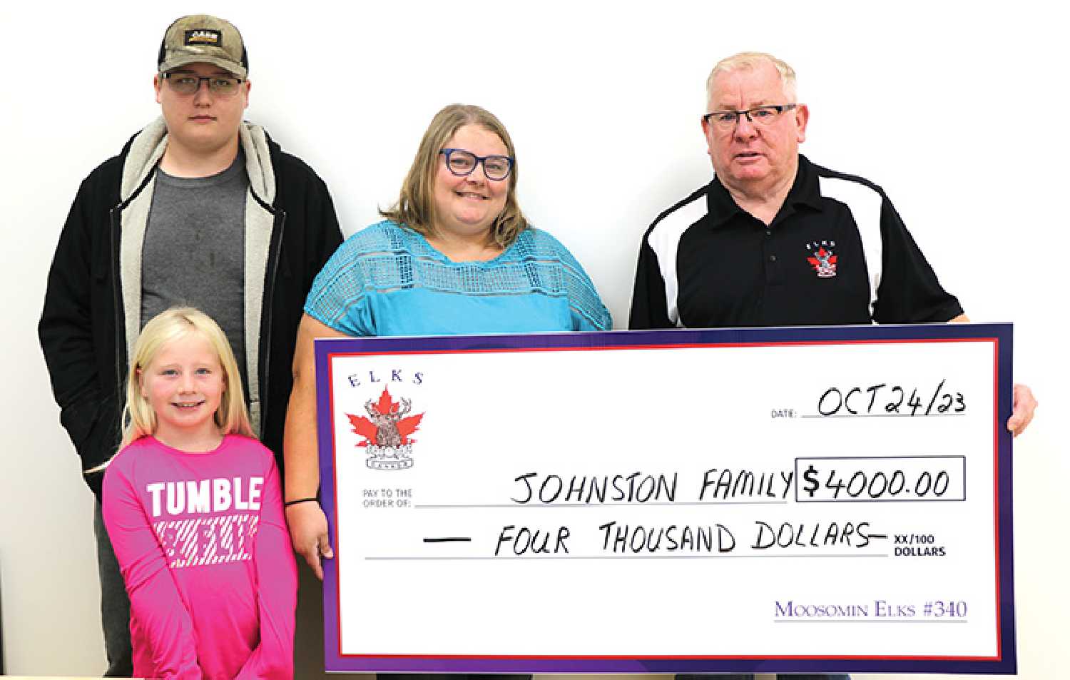 The Johnston family of Rocanville received $4,000 recently from the Moosomin Elks to help pay for hearing equipment for daughter Emily. In the photo are Dave Towler of the Elks, Jessie-Leigh Johnston, son Gabriel and daughter Hazel. Missing are Jessie-Leigh’s husband Mike and daughter Emily.